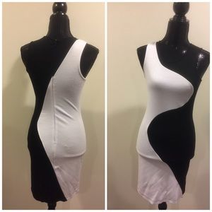 Venus: Bodycon color block black and white dress.